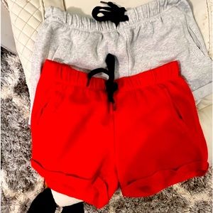 Two pairs of Boyfriend style sweat shorts by the brand PINK